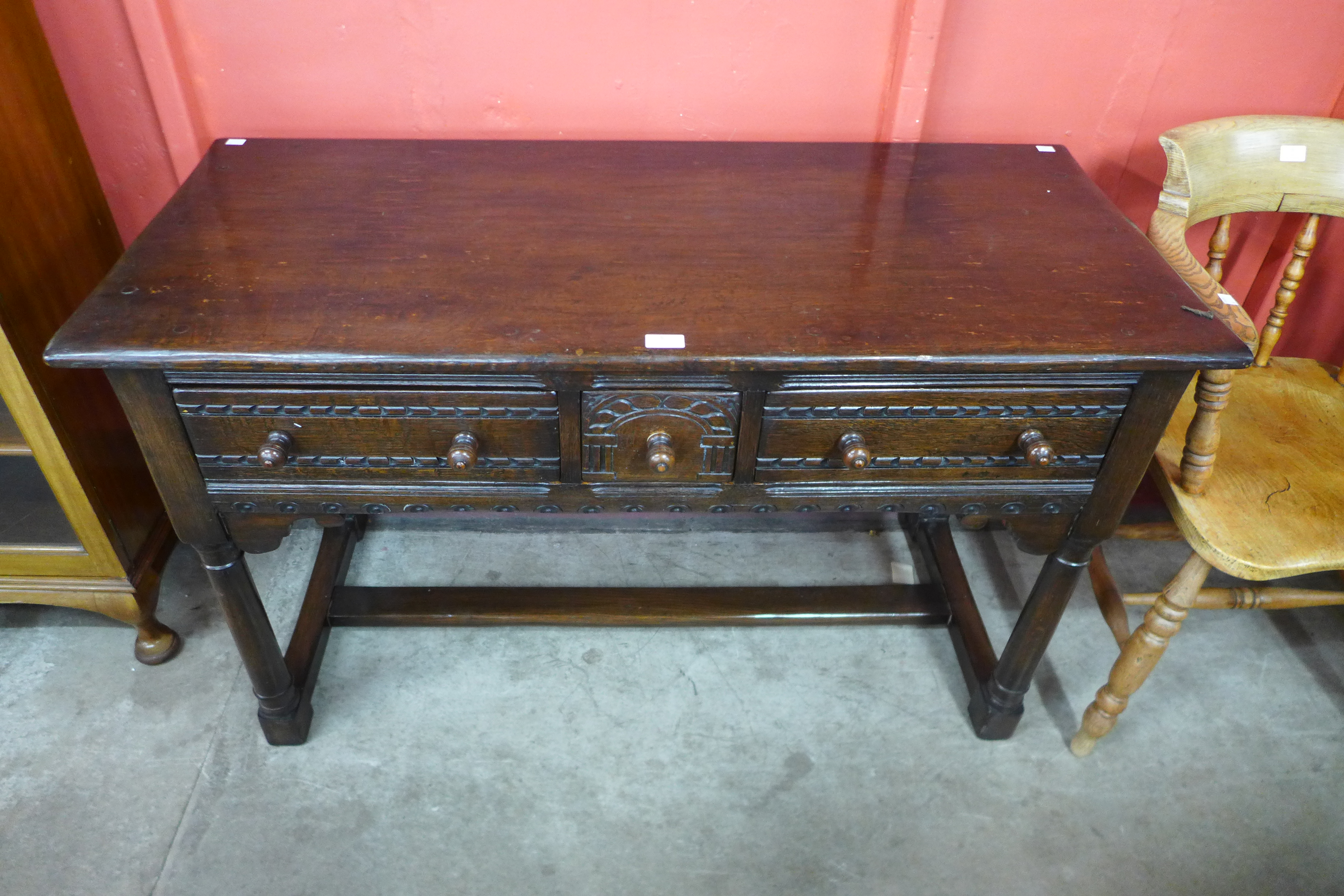 A 17th Century style oak three drawer dresser