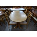 A Nathan teak extending dining table and four chairs