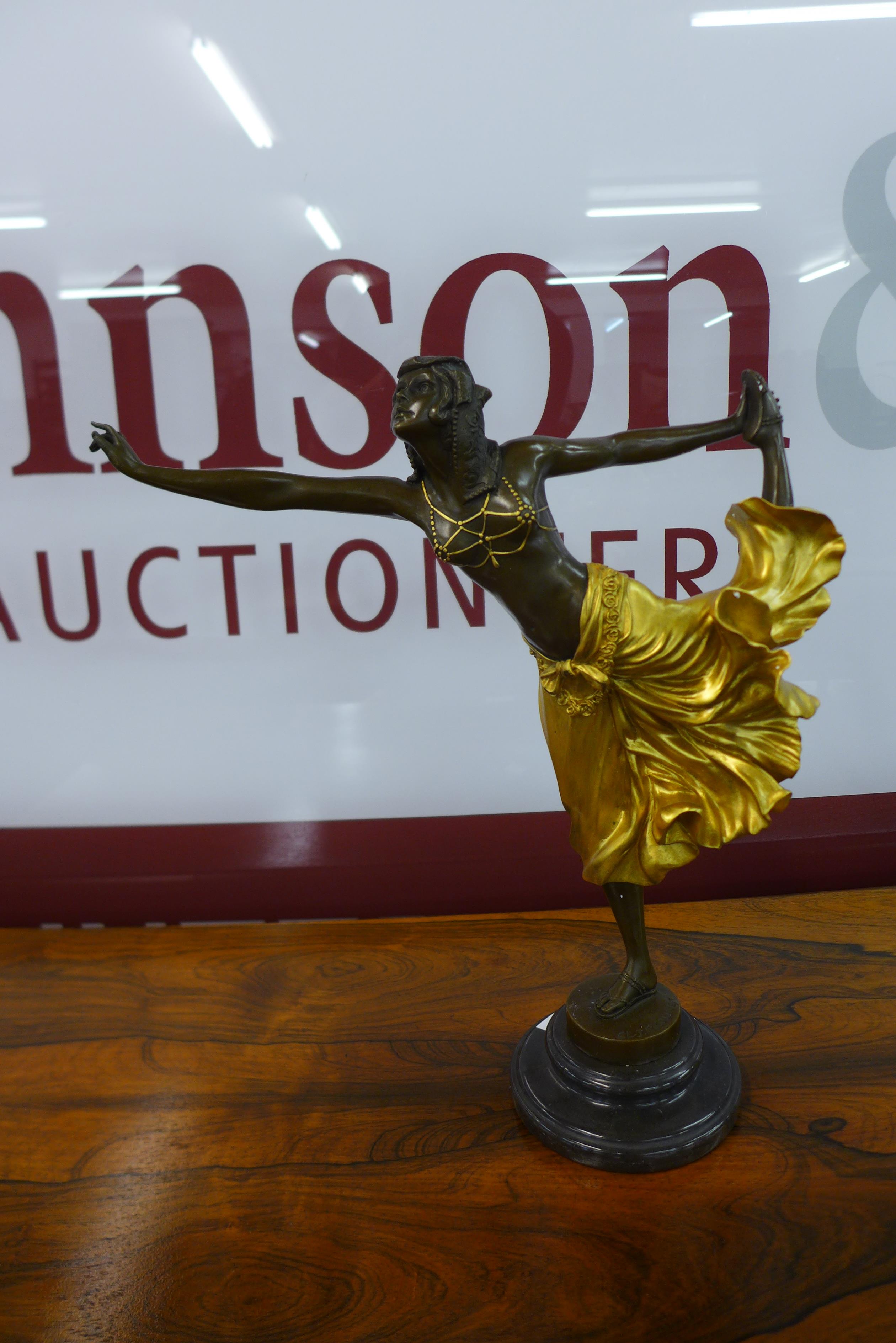 An Art Deco style gilt bronze figure of a female dancer, on black marble socle, manner of Cl.J.R.
