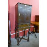 A 17th Century style carved oak cabinet on stand