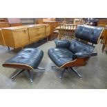 A Charles & Ray Eames style black leather, walnut and chrome revolving lounge chair and footstool