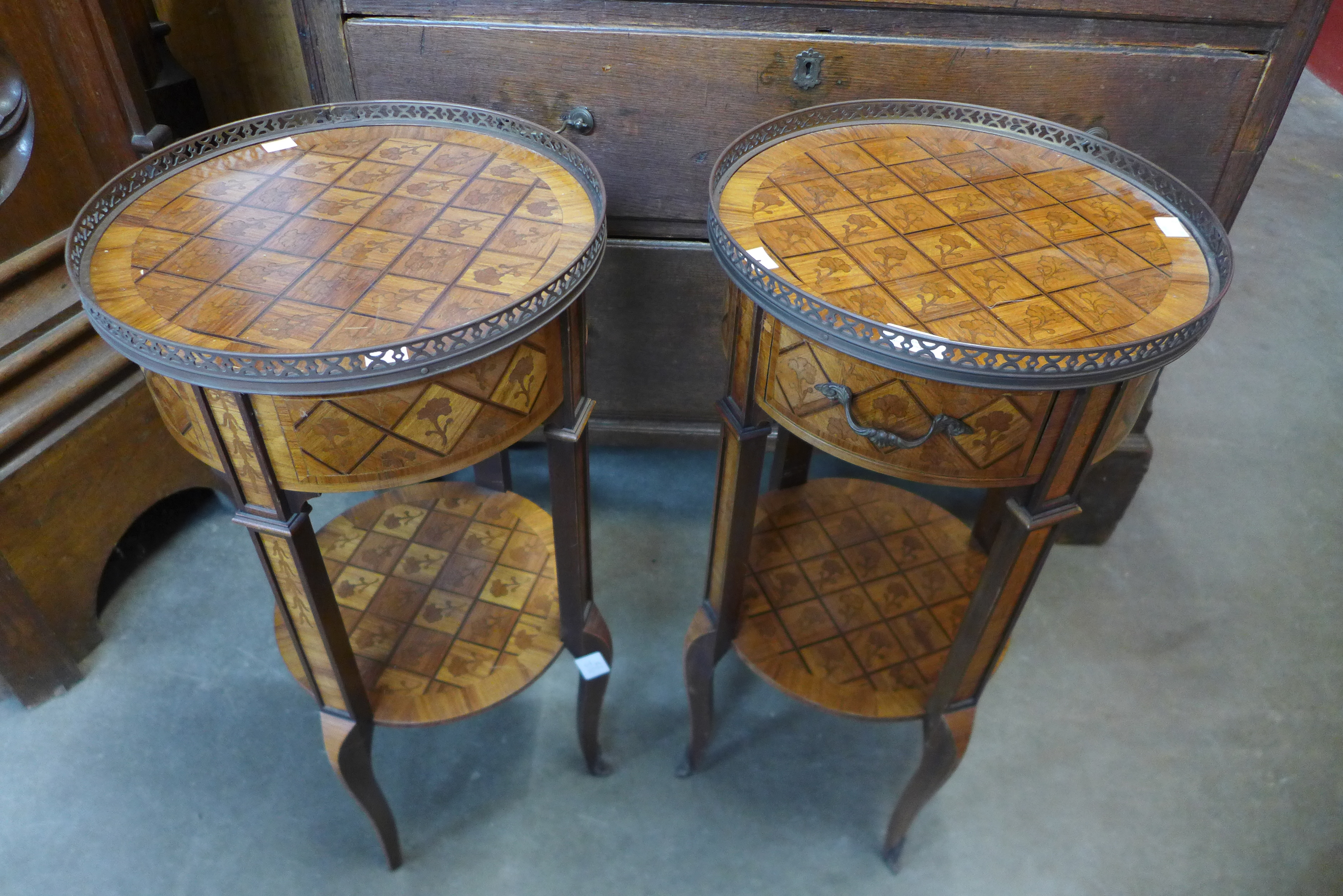 A pair of French Louis XV style inlaid walnut circular two tier etageres
