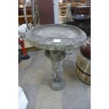 A concrete bird bath