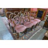 A Harlequin set of twelve Victorian walnut balloon back dining chairs (6+6)
