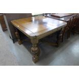 An oak draw-leaf table