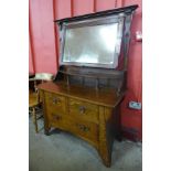 An Arts and Crafts oak and copper mounted dressing chest, manner of Liberty & Co.