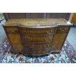 A small George III style walnut breakfront sideboard