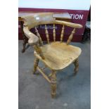 A Victorian elm smokers bow chair