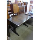 An oak draw-leaf table