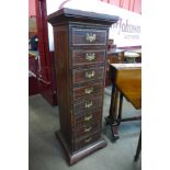 A French style simulated rosewood leather and parcel gilt eight drawer chest