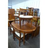 A teak extending dining table and six chairs