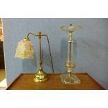 A brass and coloured glass table lamp and a glass smokers stand