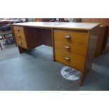 A Stag Cantata teak desk, designed by Rob Carter