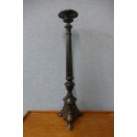 A large early 20th Century French cast iron candlestick