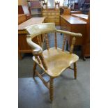 A Victorian elm smokers bow chair