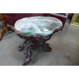 A Chinese green hardstone occasional table, on naturalistic root wood stand