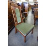 A Victorian walnut and fabric upholstered lady's chair