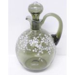 A 1960's smoked glass carafe and stopper, both enamelled with white floral decoration