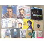 A collection of eight LP records and twenty 7" vinyl 45rpm records including The Beatles, Elvis