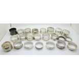 A collection of twenty-three silver napkin rings, 380g