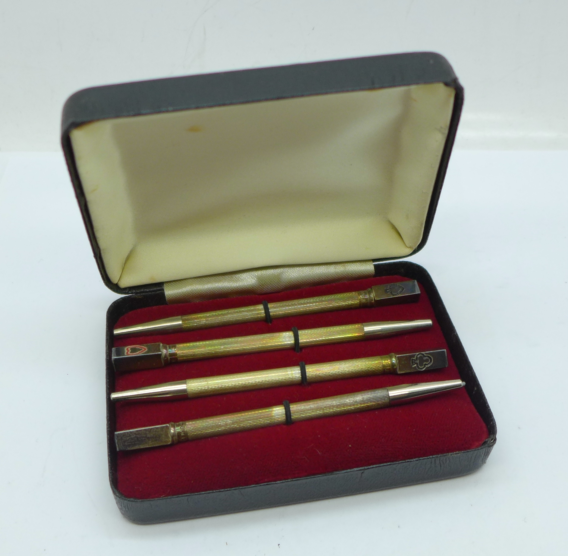 A cased set of four silver bridge pencils