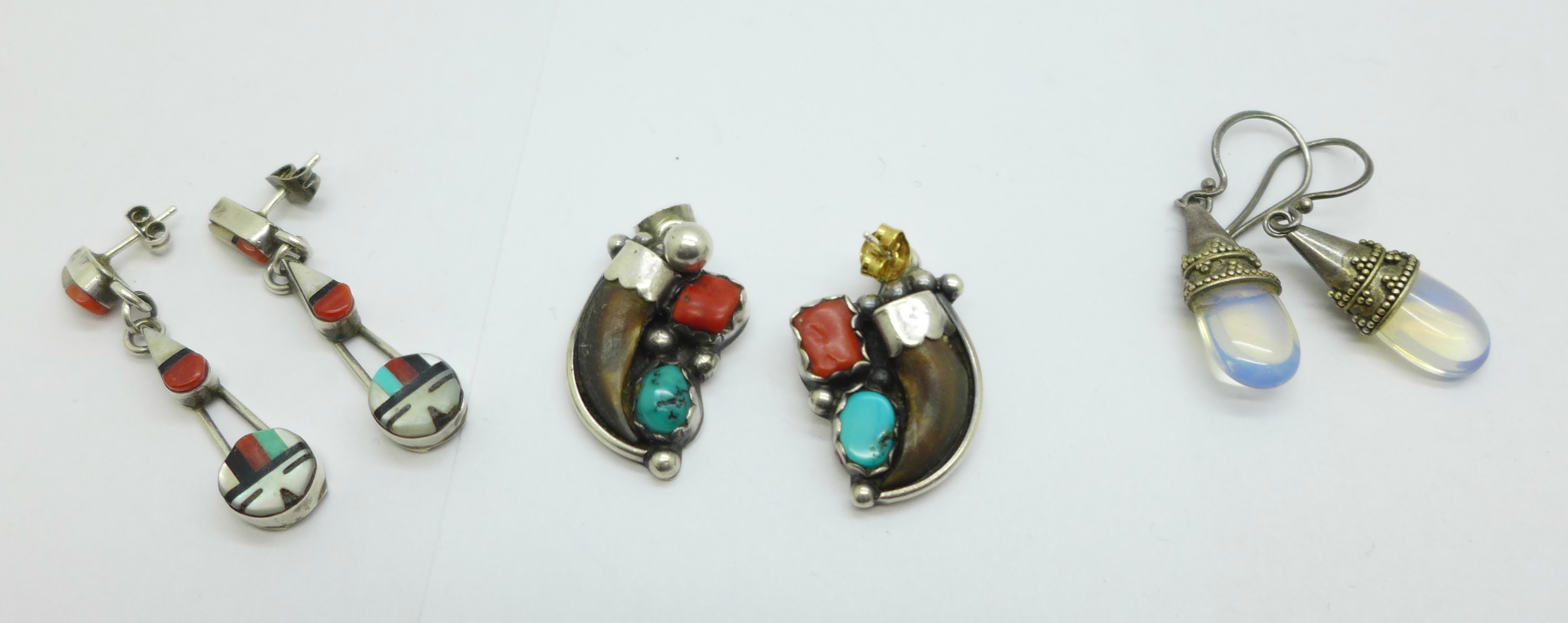 Two pairs of Native American silver earrings and one other pair of earrings