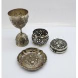 A continental white metal measure marked 900, a small dish, a napkin ring and a circular box