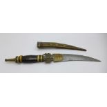 A dagger with brass scabbard