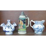 A West German stein with pewter lid, The Walt, a Delft blue and white centrepiece and a Wood and