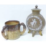 A 19th Century large saltglaze relief moulded three handled mug, hunting dog handles, scenes