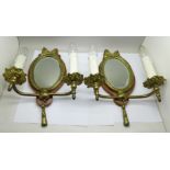 A pair of ormolu girandole oval wall mirrors, the bevelled mirrors 9cm wide