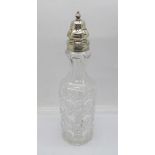 A Victorian silver topped glass shaker by William Comyns, London 1886