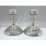 A pair of silver candlesticks, 11.5cm