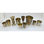 A collection of ten hallmarked silver and white metal beakers and shots including one Swedish, one