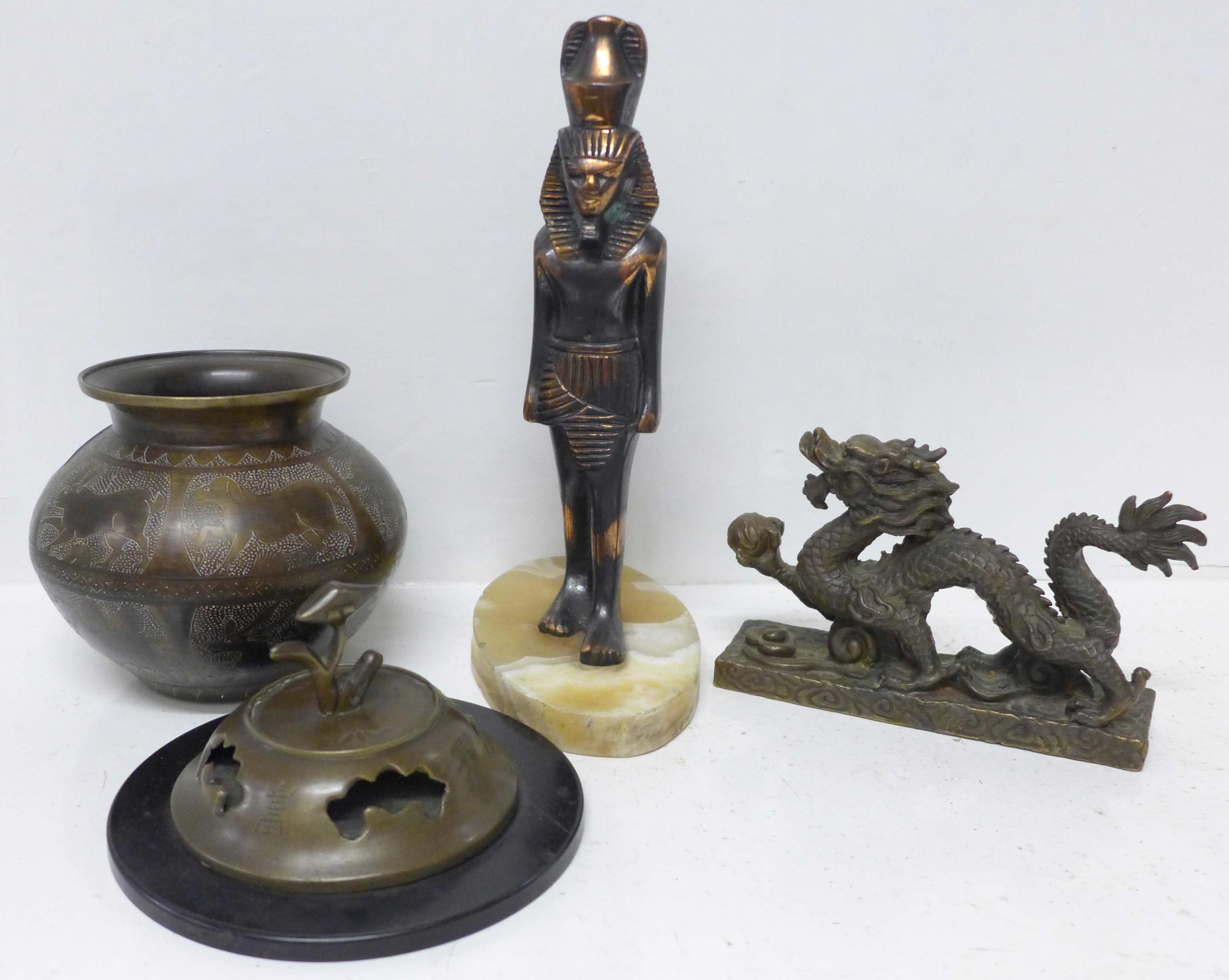 A Chinese censer, a Middle Eastern bronze pot, a Chinese brass dragon figure and an Egyptian figure