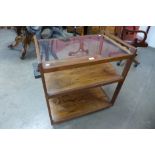 A Danish rosewood and glass topped trolley * Accompanied by CITES A10 certificate, no. 602759/01