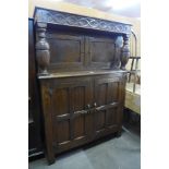 A carved Ipswich oak court cupboard