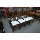 A set of eight Arts and Crafts oak dining chairs