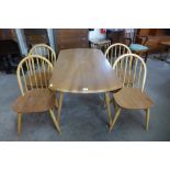 An Ercol Blonde elm and beech Windsor drop-leaf table and four Windsor chairs