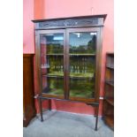 An Edward VII walnut display cabinet