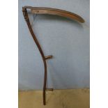 A vintage wooden scythe