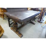 A 17th Century style carved oak draw leaf refectory table