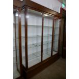 A large mahogany three door shop display cabinet, made by F. Maund & E. Berg Ltd., Showcases &