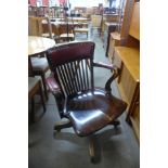 A Victorian beech revolving desk chair