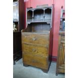 An Arts and Crafts oak and pine side cabinet