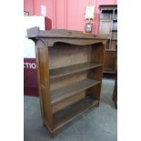 An Arts and Crafts oak open bookcase
