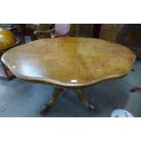 A Victorian figured walnut serpentine tilt top breakfast table