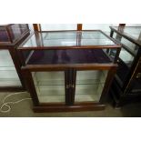 A small mahogany shop counter/cabinet