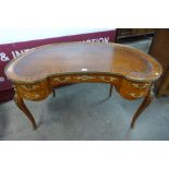 A French Louis XV style parquetry inlaid kingwood and ormolu mounted kidney shaped writing table