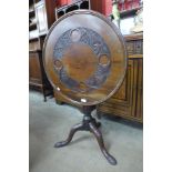 A Victorian Jas. Schoolbred mahogany tilt-top bird cage action tripod table